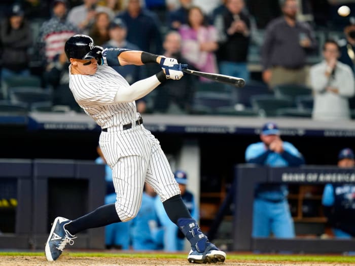 New York Yankees’ Aaron Judge hits a three-run home run during the ninth inning of a baseball game against the Toronto Blue Jays Tuesday, May 10, 2022, in New York. The Yankees won 6-5.